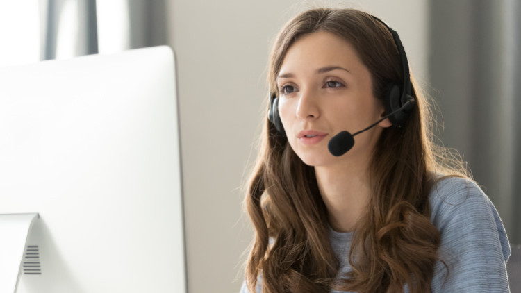 image of white woman talking using a headset