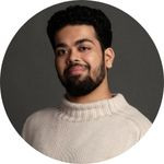 Award winner Pulkit Kumar poses in front of a grey background.