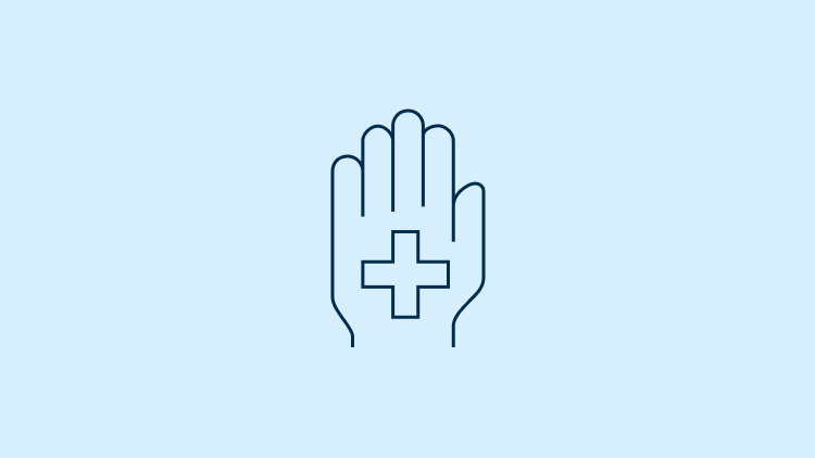 Hand with a medical sign in the middle.