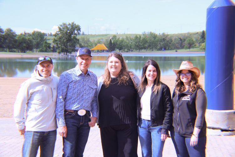Minister Todd Loewen poses with stakeholders for announcement