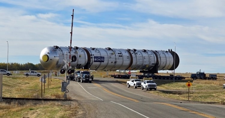 Tanker truck on the highway surrounded by fields