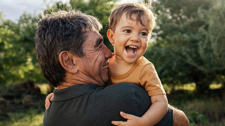 Dad holding young boy