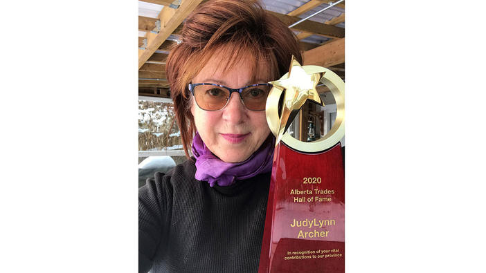 A photo of JudyLynn Archer with her award.