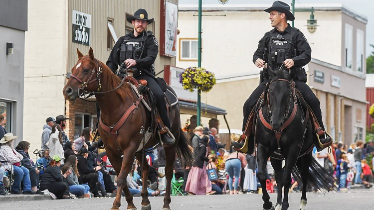 image of 2 Conservation officers on horses in a parade