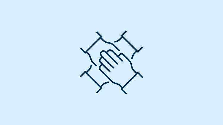 Group of hands joined together to show teamwork.