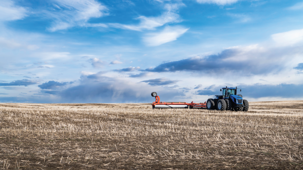 Photo of a tractor plowing the fields