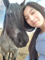 Photo of Rylee and a horse