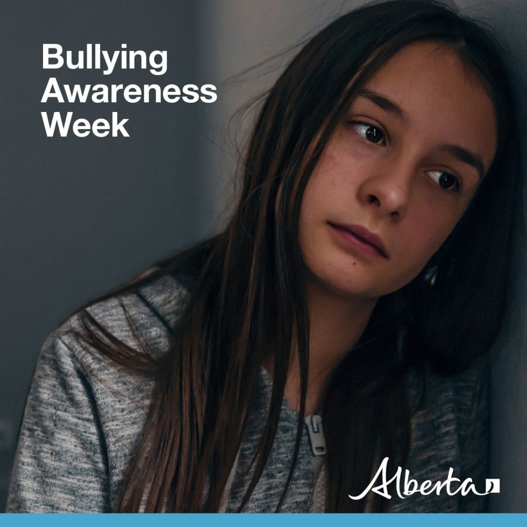 Bullying Awareness Week - social media image of teen girl with head leaning on wall