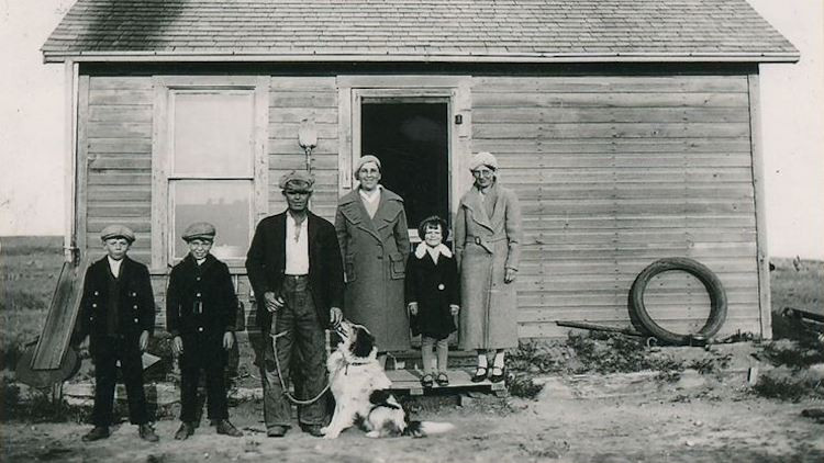 Donald Bergen family standing outside of original homestead