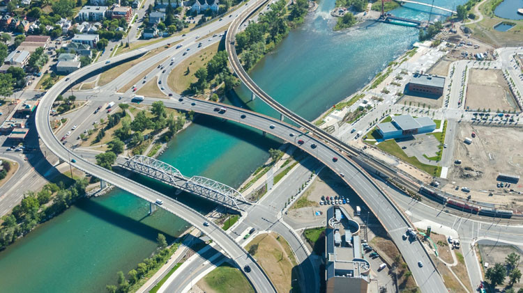An aerial view of bridges crosing a river.