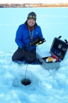 A volunteer citizen scientist collecting data while ice fishing at Spring Lake in central Alberta (photo: Alberta Lake Management Society).