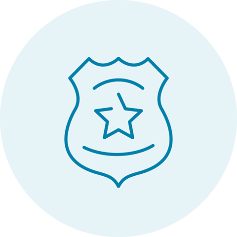 Light blue circle with a darker blue icon of a police badge with a star in the middle
