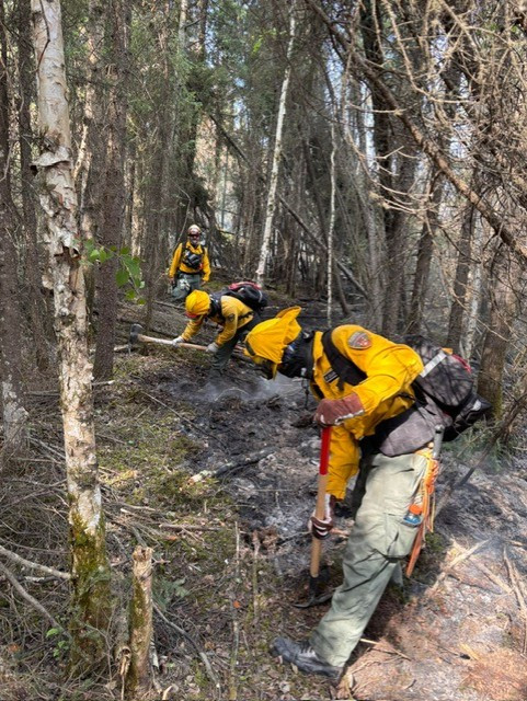 Firefighters extinguish hot spots