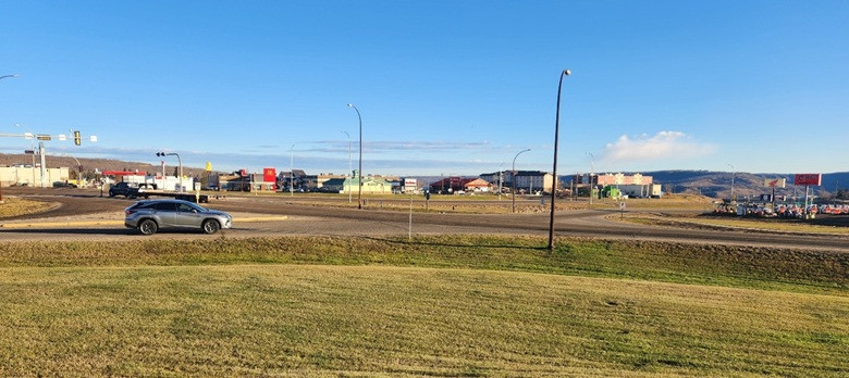 Intersection of Highway 2 and 78 Street, looking northeast with a silver SUV turning right